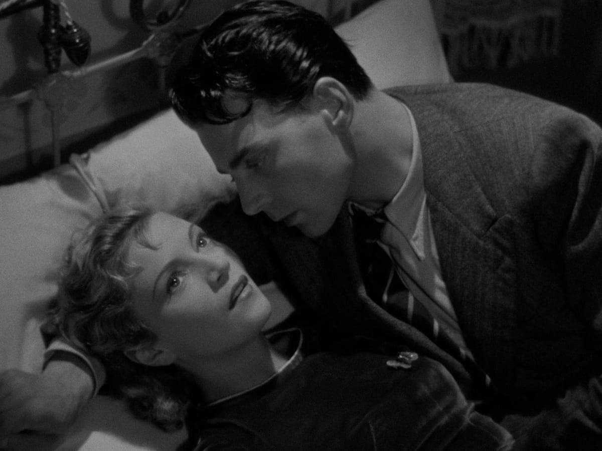 A couple contemplate their future in a still from HOTEL DU NORD.