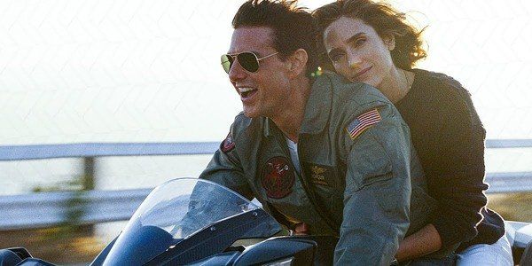 Tom Cruise and Jennifer Connelly share a motorcycle ride in TOP GUN: MAVERICK.