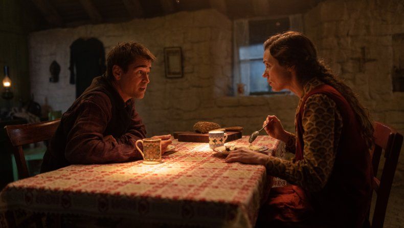 Colin Farrell and Kerry Condon have a discussion at the dinner table in THE BANSHEES OF INISHERIN.