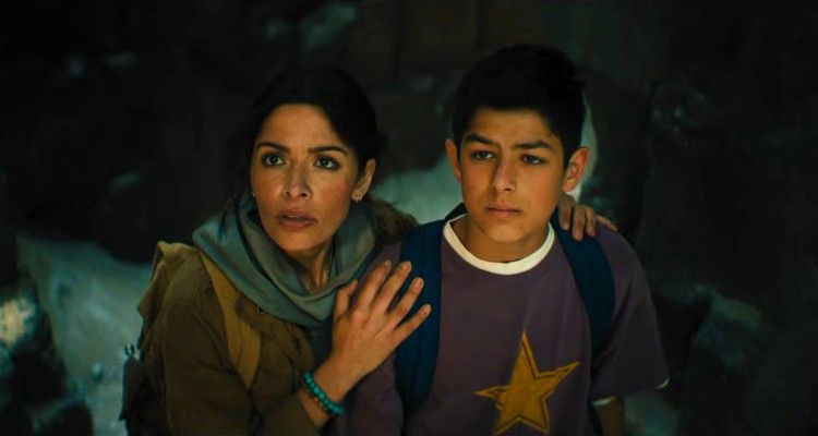 Sarah Shahi and Bodhi Sabongui cower before the wrath of various parties in BLACK ADAM.