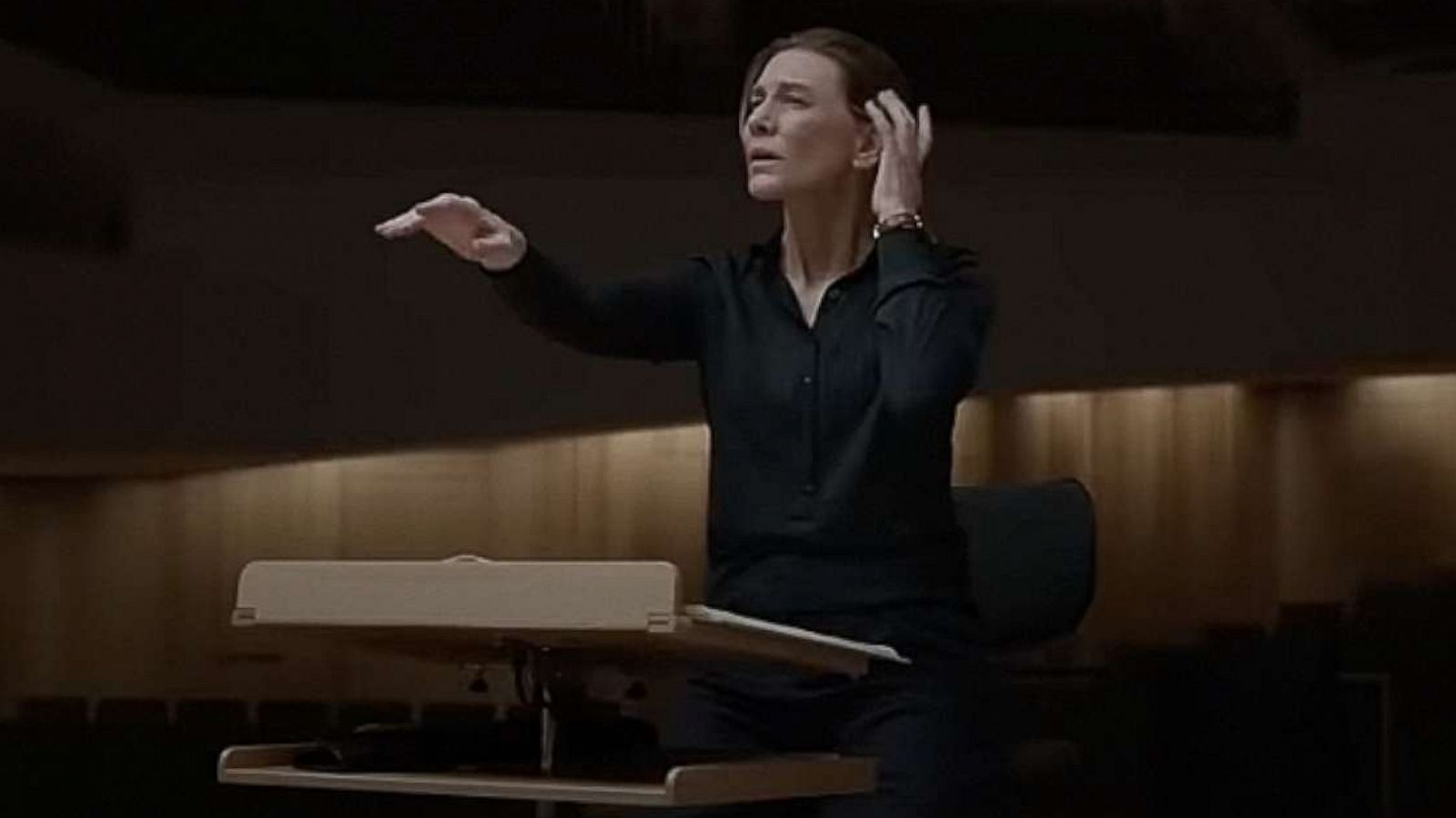 Cate Blanchett gestures with precision and intent in a still from TAR.