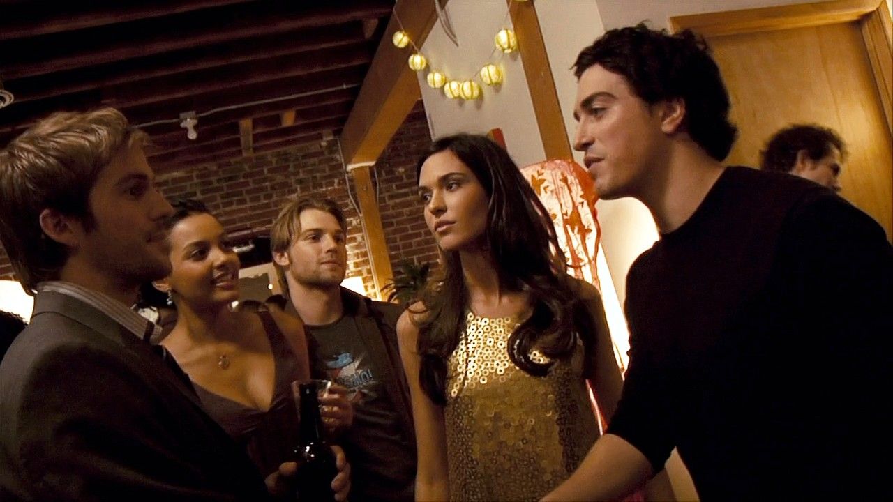 Michael Stahl-David, Jessica Lucas, Mike Vogel, Odette Yustman and Ben Schwartz party on in a still from CLOVERFIELD.