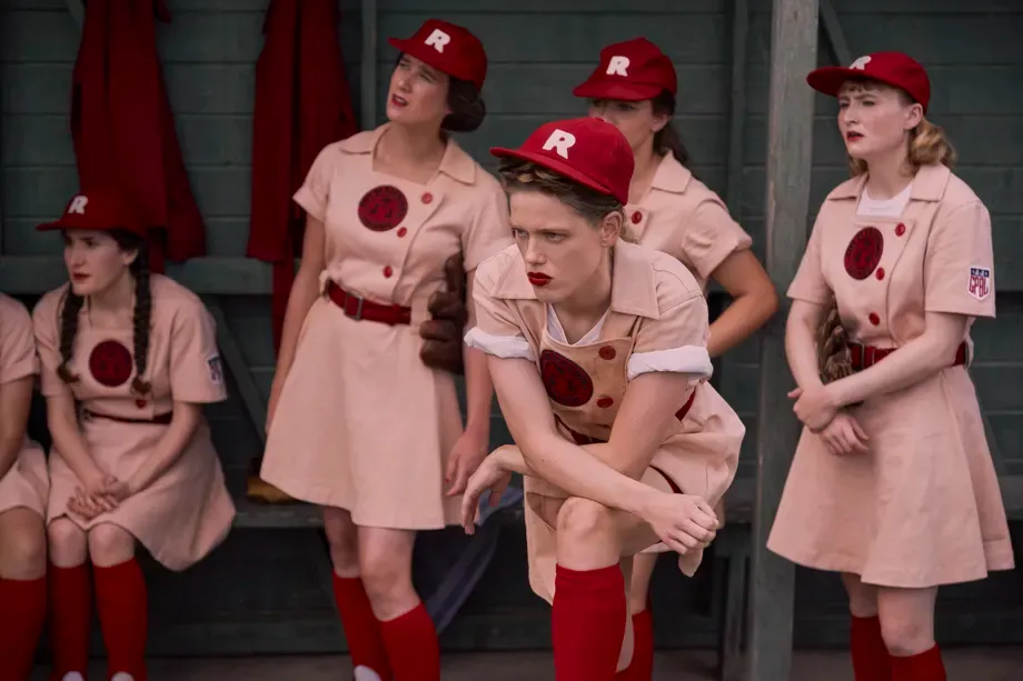 Kelly McCormick, who is awesome, scowls in the Rockford Peaches dugout in Prime Video's A LEAGUE OF THEIR OWN reboot.