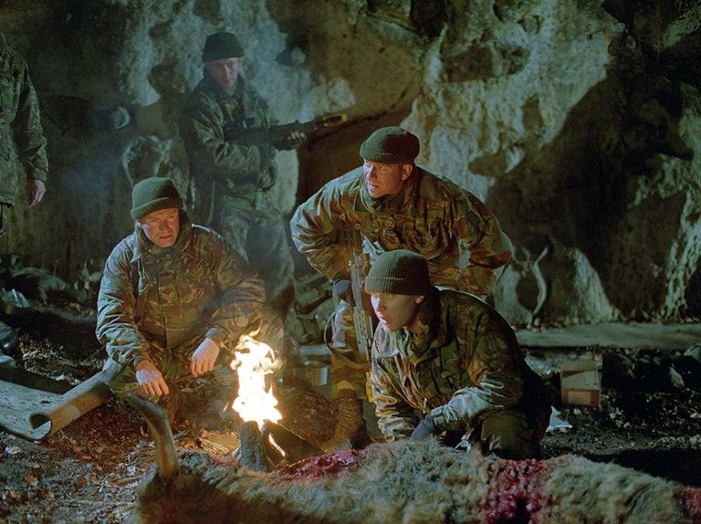British soldiers take a breather amongs the bloody carnage of Neil Marshall's DOG SOLDIERS.