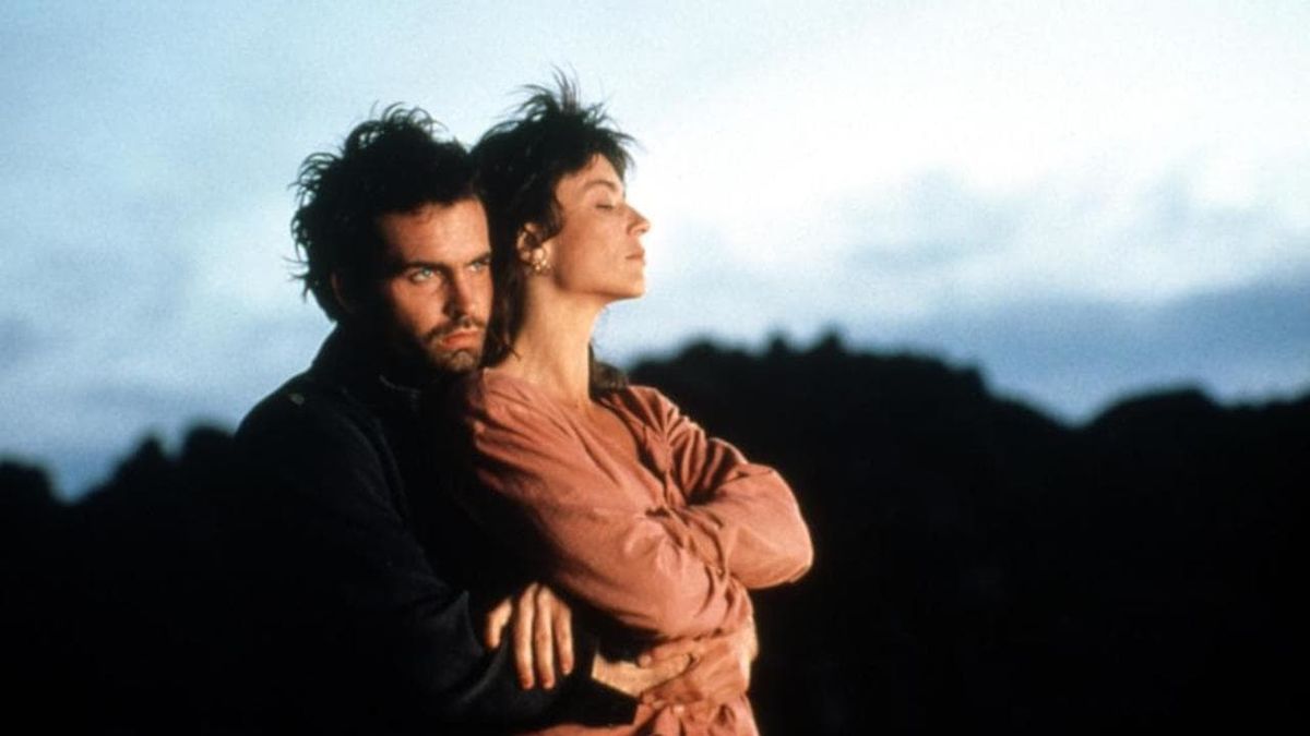 Jason Patric holds Rachel Ward against the unforgiving backdrop of nature in a still from AFTER DARK, MY SWEET. 